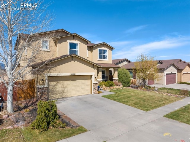 view of front of home featuring a garage, a front yard, stone siding, stucco siding, and concrete driveway