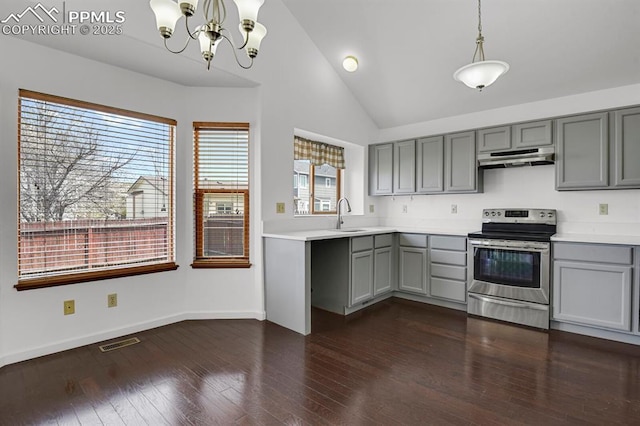 kitchen featuring gray cabinets, vaulted ceiling, under cabinet range hood, and electric range