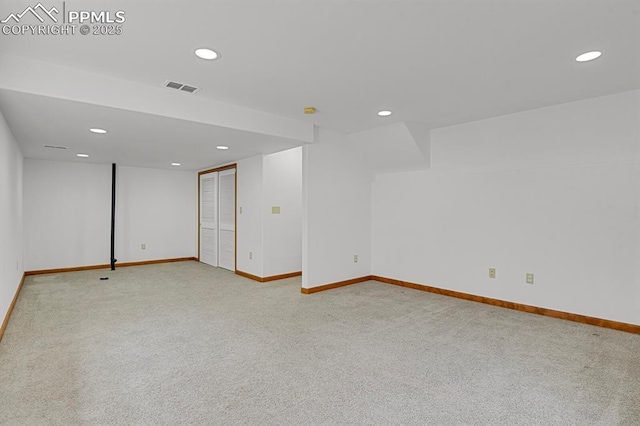 carpeted empty room with recessed lighting, visible vents, and baseboards