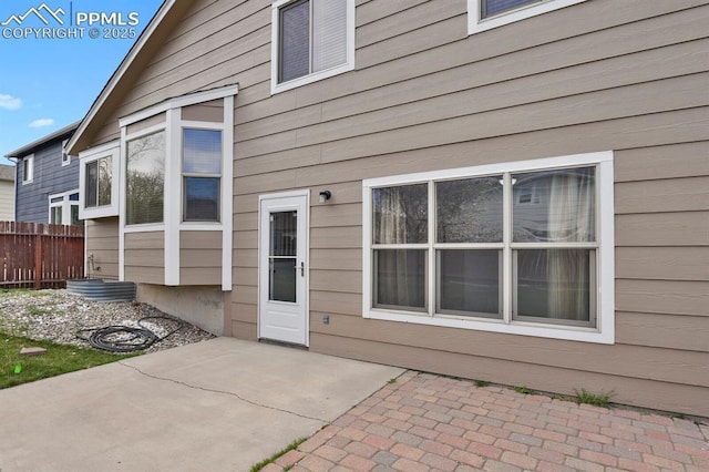 exterior space with fence and a patio