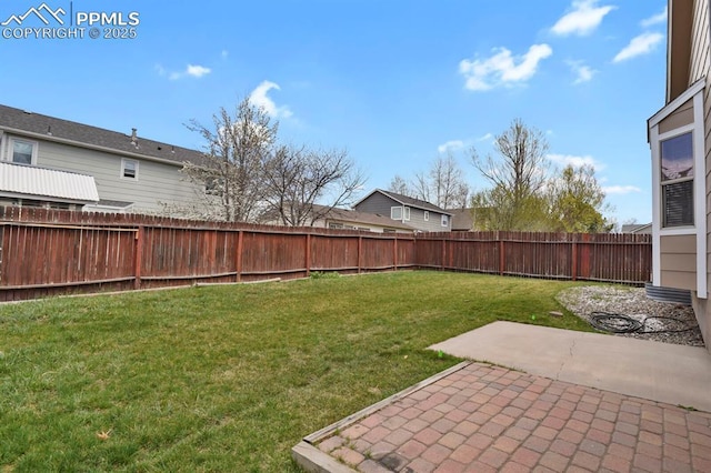 view of yard with a fenced backyard and a patio area