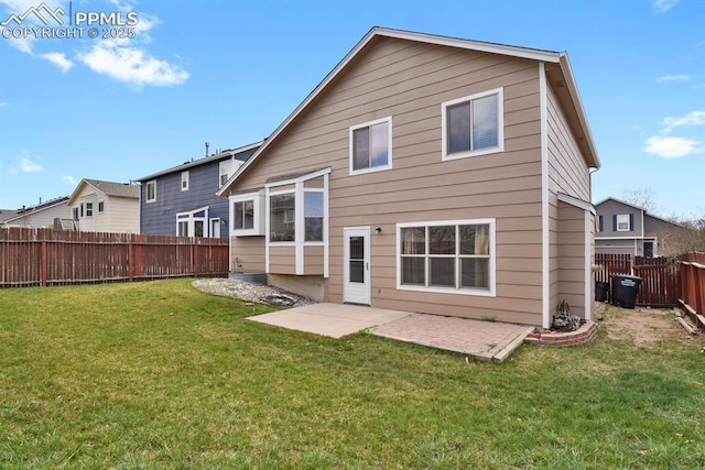 rear view of property featuring a fenced backyard, a patio area, and a lawn