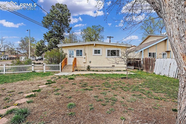 rear view of property with a fenced backyard