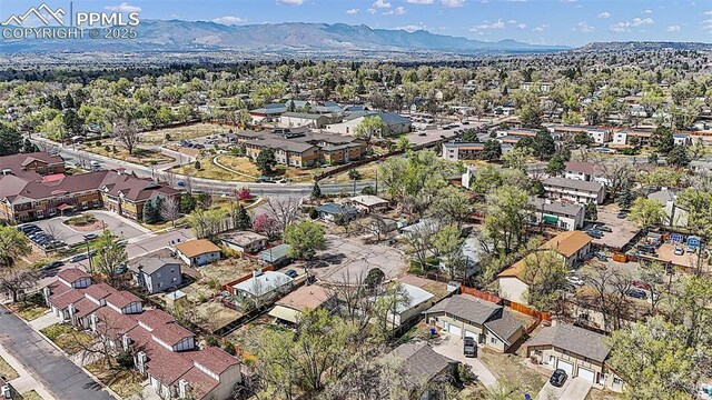 birds eye view of property featuring a mountain view