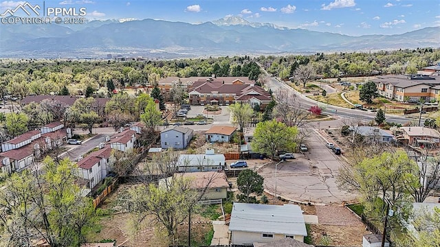 drone / aerial view featuring a residential view and a mountain view