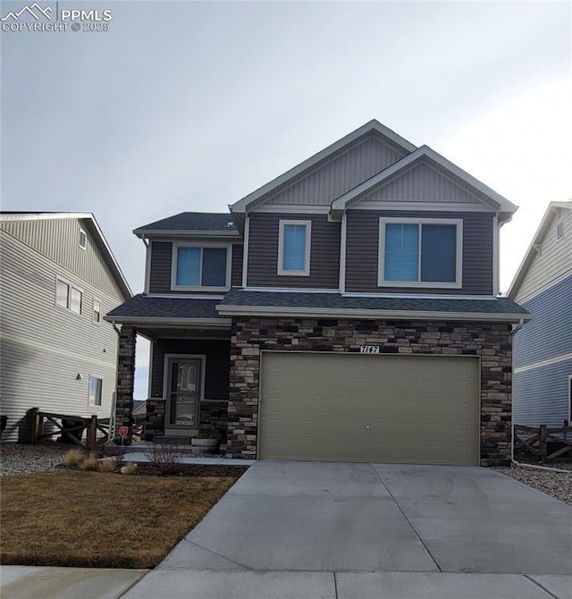 craftsman-style house with an attached garage, driveway, covered porch, and stone siding