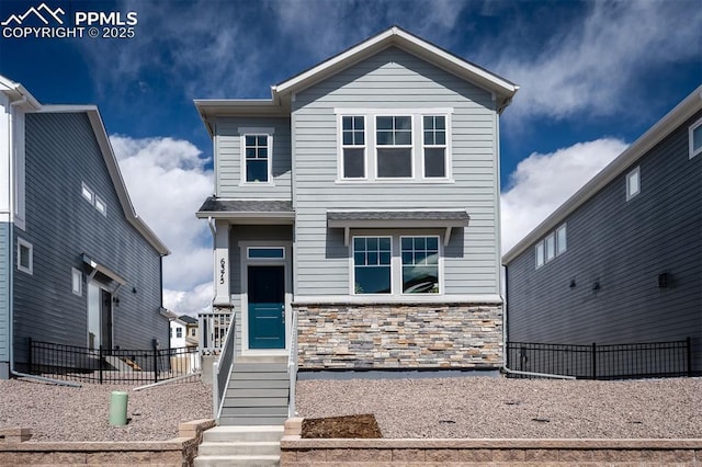 6375 Laud Pt, Colorado Springs, CO 80924 - view of front of house featuring fence and stone siding