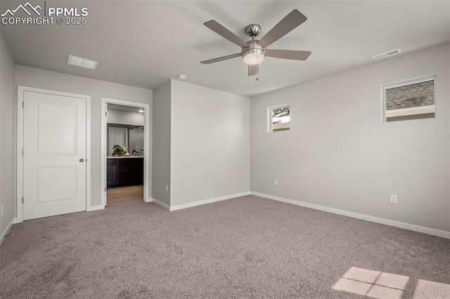 6375 Laud Pt, Colorado Springs, CO 80924 - unfurnished bedroom with visible vents, baseboards, ensuite bathroom, a ceiling fan, and carpet