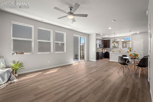 6375 Laud Pt, Colorado Springs, CO 80924 - living area with a ceiling fan, visible vents, recessed lighting, wood finished floors, and baseboards