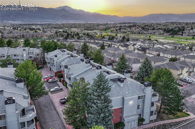 aerial view with a mountain view and a residential view