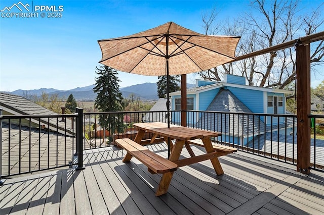 1209 W Bijou St, Colorado Springs, CO 80904 - wooden terrace with a mountain view and outdoor dining space