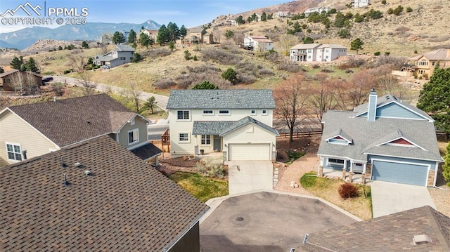 birds eye view of property with a mountain view and a residential view