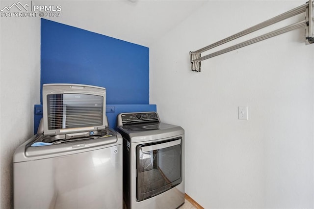 laundry room with washer and dryer and laundry area