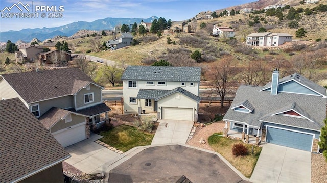 bird's eye view featuring a mountain view and a residential view