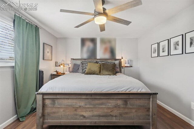 bedroom featuring ceiling fan, wood finished floors, and baseboards