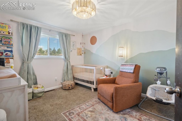 bedroom featuring carpet, a crib, a chandelier, and baseboards