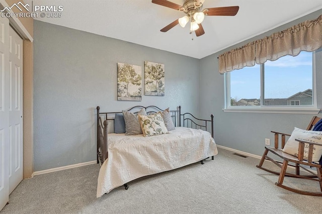 bedroom featuring carpet, baseboards, and a closet