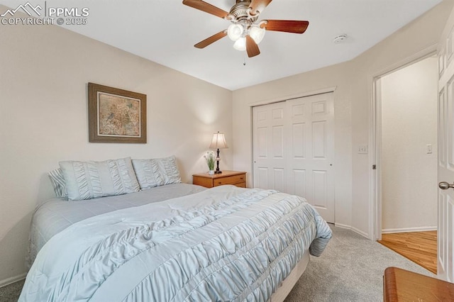 bedroom featuring carpet, a closet, baseboards, and ceiling fan