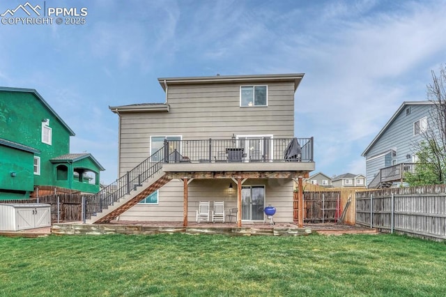 back of house featuring stairway and a deck