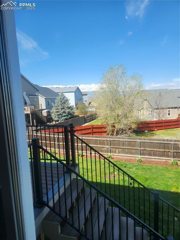balcony with stairway and a residential view