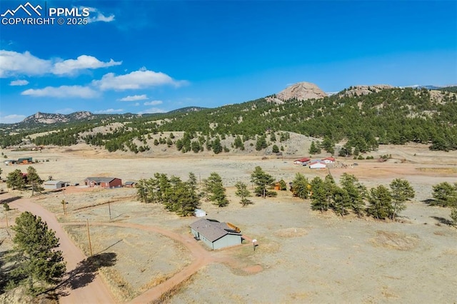 property view of mountains featuring a rural view and a desert view