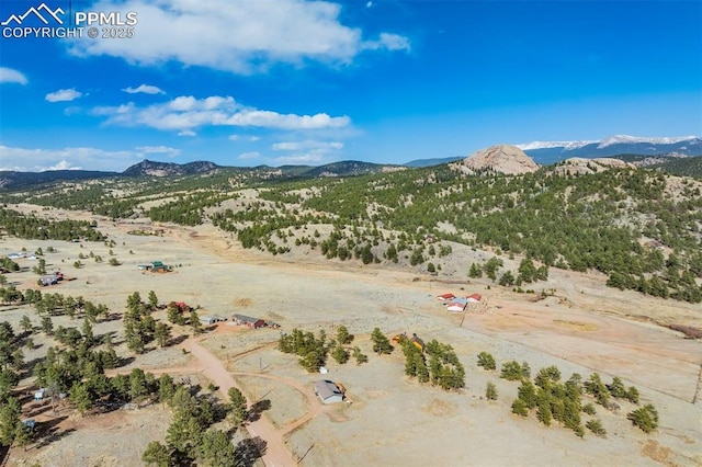 drone / aerial view with a mountain view, a rural view, and a desert view