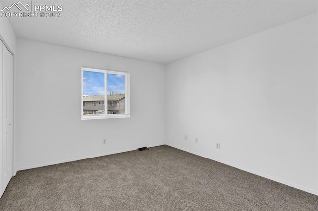 1287 Soaring Eagle Dr, Colorado Springs, CO 80915 - empty room featuring carpet, a textured ceiling, and baseboards