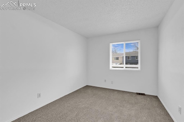 1287 Soaring Eagle Dr, Colorado Springs, CO 80915 - empty room featuring visible vents, carpet, and a textured ceiling
