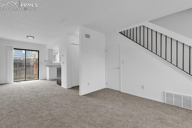 1287 Soaring Eagle Dr, Colorado Springs, CO 80915 - unfurnished living room featuring stairway, carpet flooring, a textured ceiling, and visible vents