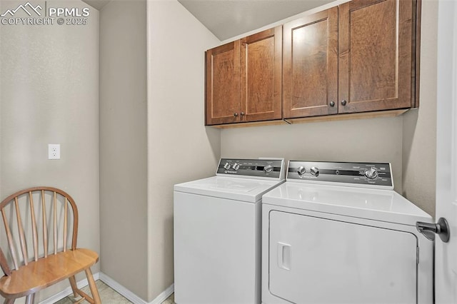 8421 Crooked Branch Ln, Colorado Springs, CO 80927 - washroom featuring cabinet space, baseboards, and washing machine and dryer