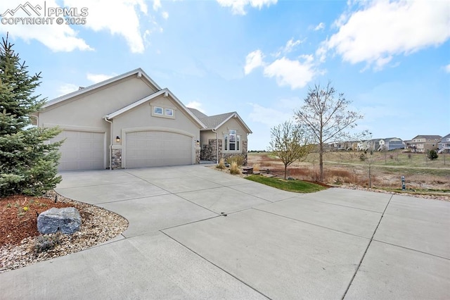 8421 Crooked Branch Ln, Colorado Springs, CO 80927 - single story home with a garage, stucco siding, stone siding, and concrete driveway