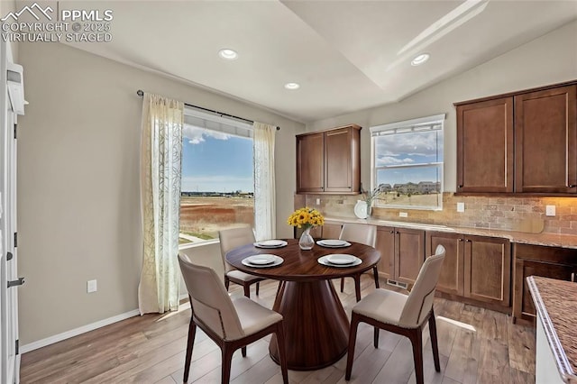 8421 Crooked Branch Ln, Colorado Springs, CO 80927 - dining space featuring light wood-style floors, recessed lighting, baseboards, and lofted ceiling