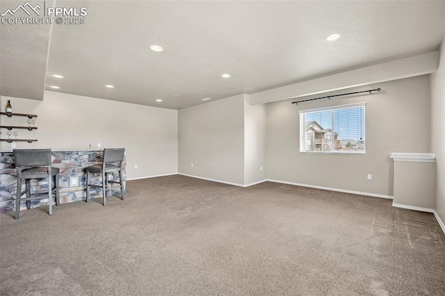 8421 Crooked Branch Ln, Colorado Springs, CO 80927 - unfurnished living room with baseboards, carpet flooring, and recessed lighting