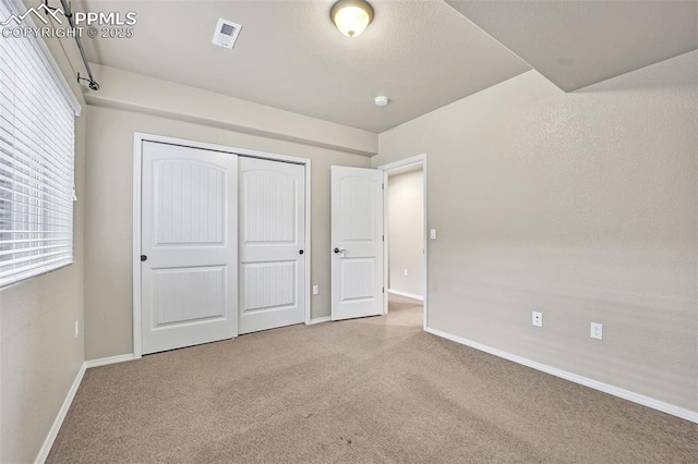 8421 Crooked Branch Ln, Colorado Springs, CO 80927 - unfurnished bedroom with carpet floors, baseboards, and a closet
