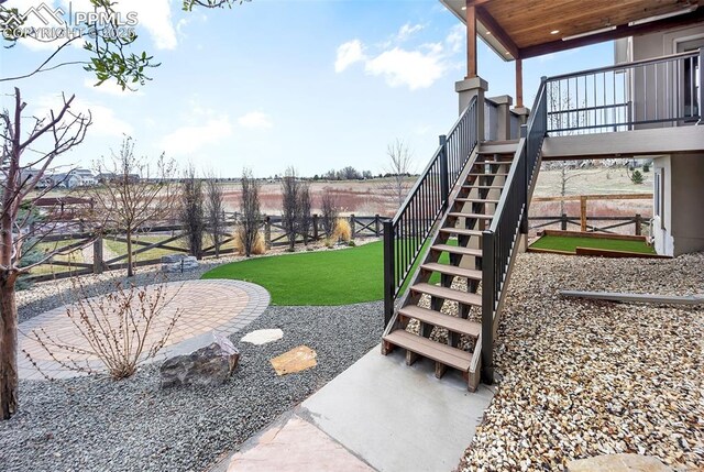 8421 Crooked Branch Ln, Colorado Springs, CO 80927 - view of yard featuring fence and stairs