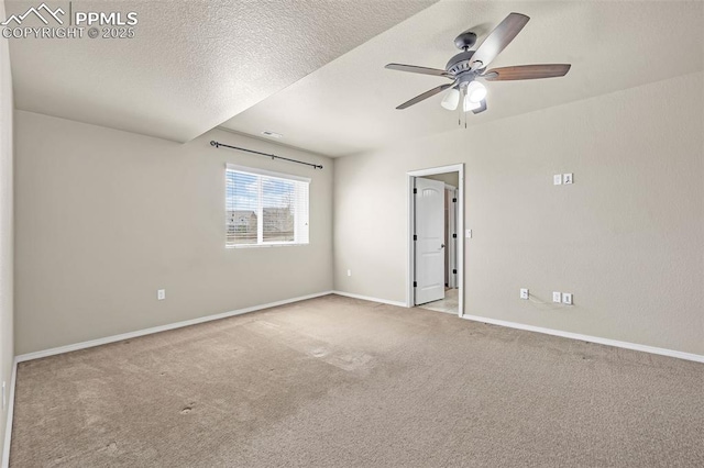 8421 Crooked Branch Ln, Colorado Springs, CO 80927 - carpeted empty room with a textured ceiling, ceiling fan, and baseboards