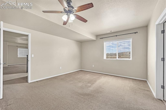 8421 Crooked Branch Ln, Colorado Springs, CO 80927 - unfurnished bedroom with carpet floors, a textured ceiling, ceiling fan, and baseboards