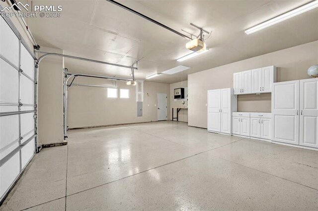 8421 Crooked Branch Ln, Colorado Springs, CO 80927 - garage featuring a garage door opener and electric panel