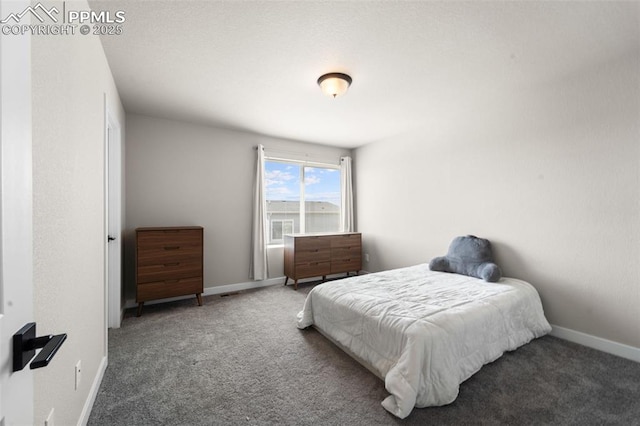 carpeted bedroom with baseboards