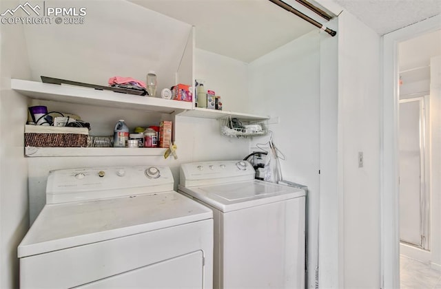 washroom featuring independent washer and dryer and laundry area
