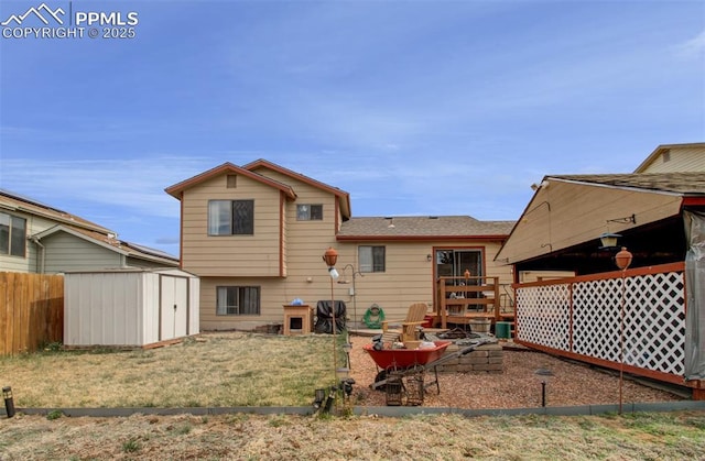 back of property with fence, an outdoor structure, and a storage shed