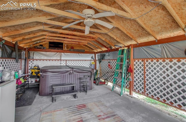 view of patio featuring a ceiling fan, fence, and a hot tub
