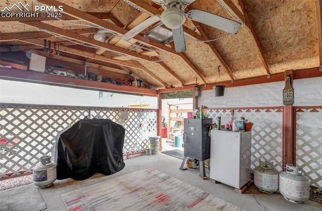 exterior space with fence, grilling area, and ceiling fan