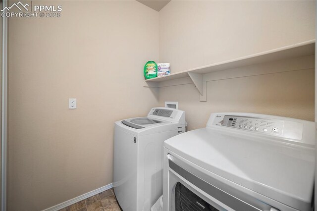 2404 Obsidian Forest Vw, Colorado Springs, CO 80951 - clothes washing area with washing machine and clothes dryer, laundry area, and baseboards