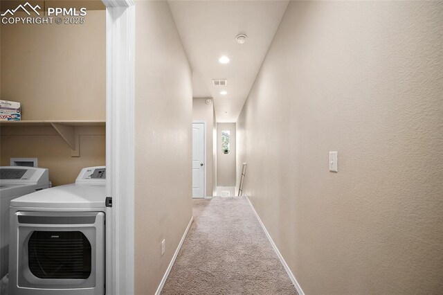 2404 Obsidian Forest Vw, Colorado Springs, CO 80951 - hall with independent washer and dryer, an upstairs landing, visible vents, carpet, and baseboards