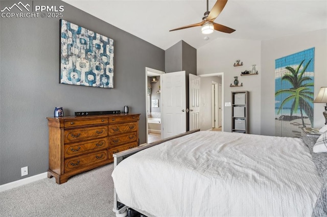 carpeted bedroom featuring lofted ceiling, a ceiling fan, baseboards, and ensuite bath