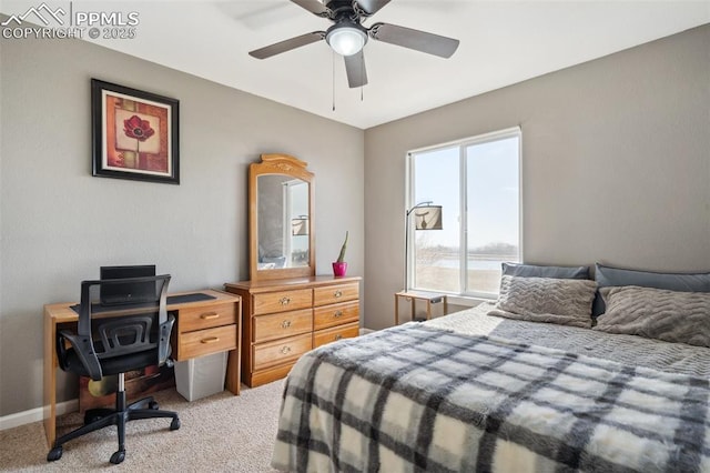 bedroom featuring ceiling fan and light carpet