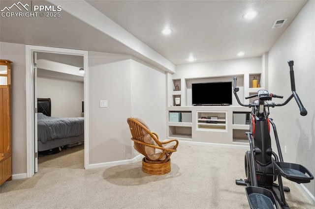 workout area with carpet floors, visible vents, built in features, and baseboards