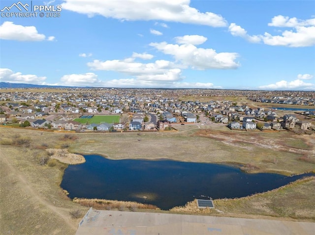 bird's eye view featuring a residential view and a water view