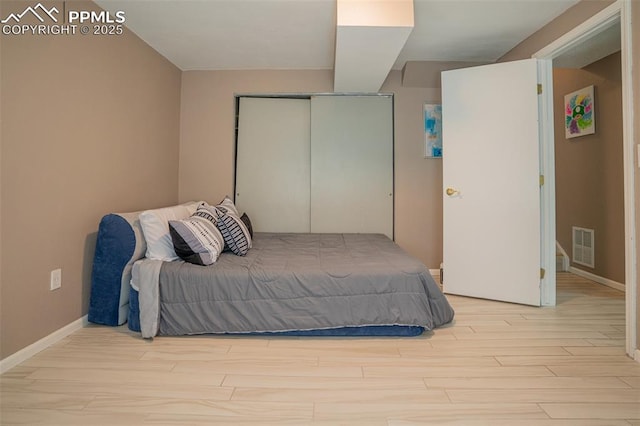 270 Wallace St, Colorado Springs, CO 80911 - bedroom with baseboards, wood finished floors, visible vents, and a closet